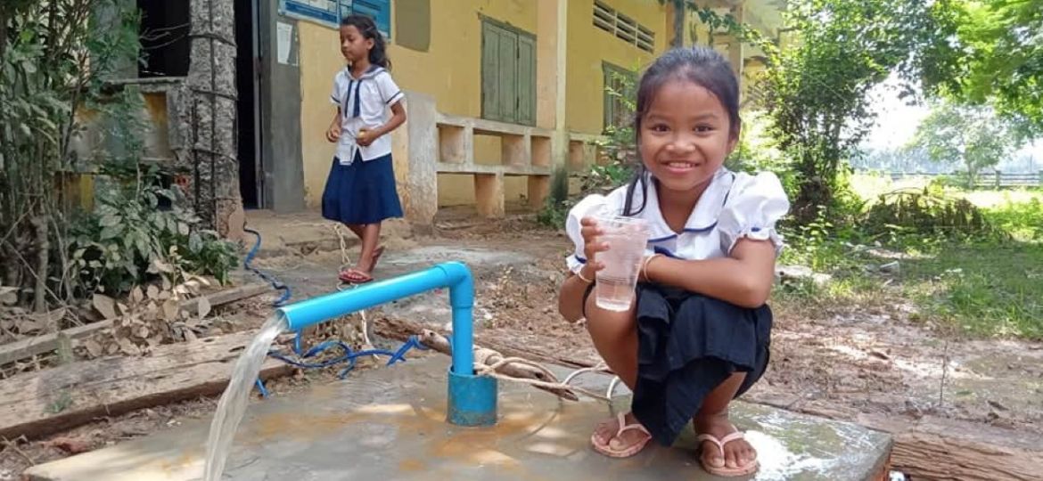 girl-at-water-well-cambodia-rock-foundation-clean-water